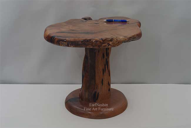 live edge pedestal shown with pen for perspective